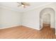 Bright living room features hardwood floors, ceiling fan and neutral paint scheme at 1909 Redding Lane, Durham, NC 27712