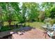 Inviting backyard with wooden deck and outdoor seating, perfect for relaxing and entertaining in a serene, green setting at 20 Keswick Ct, Durham, NC 27713