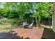This backyard has lush landscaping, a wooden deck, and outdoor seating at 20 Keswick Ct, Durham, NC 27713