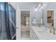 Bathroom view into the main bedroom, featuring double sinks and stylish decor at 20 Keswick Ct, Durham, NC 27713
