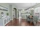 Cozy dining area adjacent to the kitchen, featuring ample natural light and a stylish chandelier at 20 Keswick Ct, Durham, NC 27713