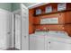 The laundry room features a washer, dryer, and shelving for storage at 20 Keswick Ct, Durham, NC 27713