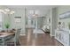 Spacious living room with hardwood floors and an open floorplan to the dining room and entryway at 20 Keswick Ct, Durham, NC 27713