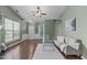Bright living room featuring a fireplace, large window, and an open layout with views of the entrance at 20 Keswick Ct, Durham, NC 27713