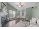 Inviting living area with a cozy fireplace, vaulted ceiling, and a seamless transition to the dining area at 20 Keswick Ct, Durham, NC 27713