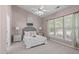 This main bedroom is bright and cozy with a ceiling fan and neutral decor at 20 Keswick Ct, Durham, NC 27713