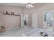 This main bedroom boasts neutral decor, shelving, and access to an ensuite bathroom at 20 Keswick Ct, Durham, NC 27713