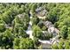 Another charming aerial view of homes nestled between mature trees, offering a peaceful and nature-filled setting at 20011 Bragg, Chapel Hill, NC 27517