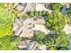 Aerial view of a luxurious home with mature trees and landscaping at 20011 Bragg, Chapel Hill, NC 27517