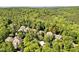 Aerial view of a luxury home nestled in a lush, green forest with privacy and seclusion at 20011 Bragg, Chapel Hill, NC 27517