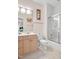 Well-lit bathroom featuring a tub-shower combo, a single vanity, and tile flooring at 20011 Bragg, Chapel Hill, NC 27517
