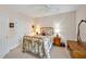 Traditional bedroom featuring a brass bed, white closet doors, and warm lighting at 20011 Bragg, Chapel Hill, NC 27517