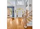 Spacious foyer featuring hardwood floors, staircase with decorative railing, and lots of natural light at 20011 Bragg, Chapel Hill, NC 27517