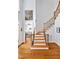 Elegant foyer with hardwood floors, staircase, and a view into the living area at 20011 Bragg, Chapel Hill, NC 27517