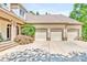 Spacious three-car garage with beautiful landscaping and a stone accented facade at 20011 Bragg, Chapel Hill, NC 27517