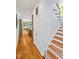 Inviting hallway leading to an open floor plan with stairs, hardwood floors, and access to a bright kitchen at 20011 Bragg, Chapel Hill, NC 27517