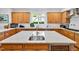 Open kitchen featuring granite counters, stainless steel sink in island, and stainless steel appliances at 20011 Bragg, Chapel Hill, NC 27517