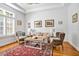 Cozy living room featuring hardwood floors, a decorative rug, and comfortable seating at 20011 Bragg, Chapel Hill, NC 27517
