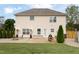 Exterior view of the home and large backyard featuring an outdoor seating area and green foliage at 203 Green Pasture Rd, Mebane, NC 27302