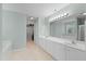 Bright bathroom with double sink vanity, walk-in closet, and bathtub at 203 Green Pasture Rd, Mebane, NC 27302