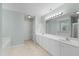 Bright bathroom with double sink vanity, tub, shower and neutral flooring at 203 Green Pasture Rd, Mebane, NC 27302