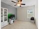 Cozy bedroom featuring a ceiling fan and a bright window that provides ample natural light at 203 Green Pasture Rd, Mebane, NC 27302