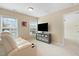 Cozy bedroom featuring a TV, a storage console, and natural light from the windows at 203 Green Pasture Rd, Mebane, NC 27302