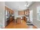 Bright kitchen with stainless steel appliances, wooden cabinets, and a large island with bar seating at 203 Green Pasture Rd, Mebane, NC 27302