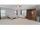 Bright main bedroom features tray ceiling, sauna, sitting area and neutral decor at 203 Green Pasture Rd, Mebane, NC 27302
