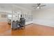 Bright office space with wood floors, modern ceiling fan, and large built in cabinet at 203 Green Pasture Rd, Mebane, NC 27302