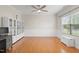 Bright office space with wood floors, modern ceiling fan, and a large window at 203 Green Pasture Rd, Mebane, NC 27302