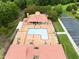 Aerial view of community pool with surrounding seating and manicured landscaping and dedicated parking lot at 203 Green Pasture Rd, Mebane, NC 27302