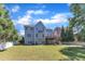 Large backyard featuring a multilevel deck and mature landscaping at 2049 Rainy Lake St, Wake Forest, NC 27587