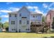 Large backyard featuring a multilevel deck and mature landscaping at 2049 Rainy Lake St, Wake Forest, NC 27587