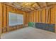 Unfinished basement with framing, insulation, and window at 2049 Rainy Lake St, Wake Forest, NC 27587