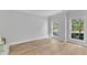 Well-lit room featuring hardwood floors, neutral paint, and large windows at 2049 Rainy Lake St, Wake Forest, NC 27587
