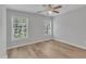 Bedroom with wood floors, ceiling fan, and natural light at 2049 Rainy Lake St, Wake Forest, NC 27587