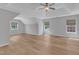 Spacious primary bedroom with tray ceiling, large windows, and hardwood floors at 2049 Rainy Lake St, Wake Forest, NC 27587