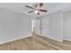 Bedroom with wood floors, neutral walls, and hall access at 2049 Rainy Lake St, Wake Forest, NC 27587