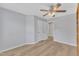 Spacious bedroom with ceiling fan, walk-in closet, and wood-look floors at 2049 Rainy Lake St, Wake Forest, NC 27587