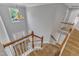 View from the top of stairs showing the chandelier and wood floors at 2049 Rainy Lake St, Wake Forest, NC 27587