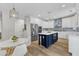 A kitchen featuring stainless steel appliances, custom white cabinetry, a center island, and a dining area at 2049 Rainy Lake St, Wake Forest, NC 27587