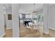 Open-concept kitchen features stainless appliances, pendant lighting, a dark-blue kitchen island, and a dining area at 2049 Rainy Lake St, Wake Forest, NC 27587