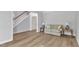 Inviting living room featuring hardwood floors, neutral paint, and staircase at 2049 Rainy Lake St, Wake Forest, NC 27587