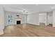 Comfortable living room showcasing hardwood floors, fireplace, and ample natural light at 2049 Rainy Lake St, Wake Forest, NC 27587