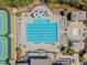A community pool with a slide and a zero entry area are surrounded by lounge chairs and manicured landscaping at 2049 Rainy Lake St, Wake Forest, NC 27587