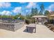 Community pool area with lounge area, tables, pool house, and stone wall at 2049 Rainy Lake St, Wake Forest, NC 27587