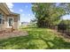 Landscaped backyard with green lawn and patio at 210 Mediate Dr, Raleigh, NC 27603