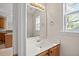 Bathroom vanity with a white sink and a large mirror at 210 Mediate Dr, Raleigh, NC 27603