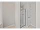 Bright bathroom features a walk-in shower with glass door and neutral paint at 210 Mediate Dr, Raleigh, NC 27603